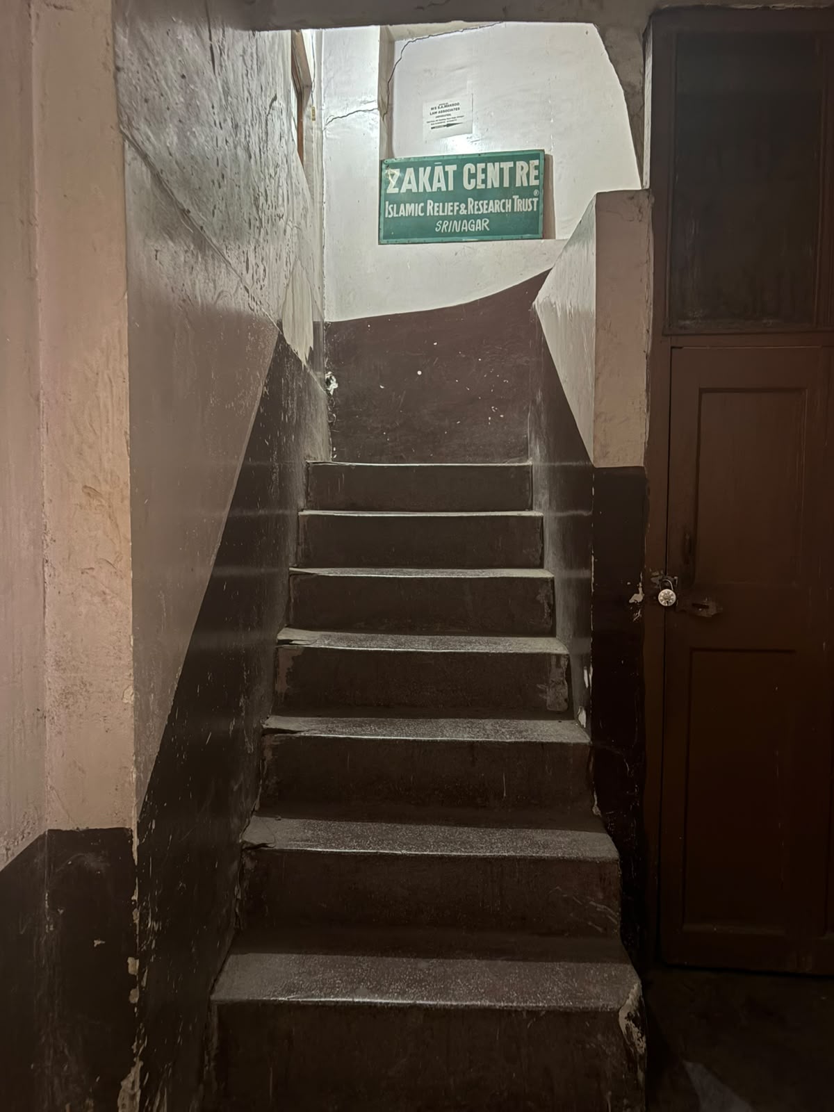 Photo 2: Staircase inside the building leading towards the clinic